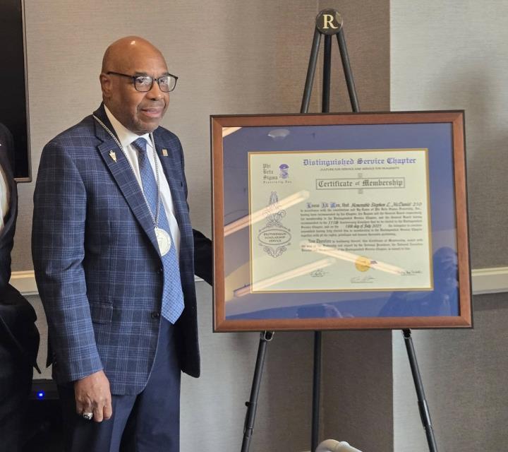 stephen-mcdaniel-receives-his-distinguished-service-chapter-pin-and-certificate.jpg